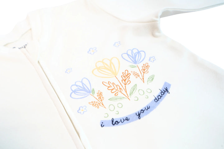 Babywear white fabric with pastel daisy prints.
